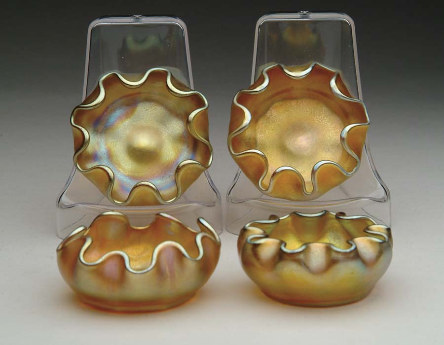 Appraisal: FOUR TIFFANY SALTS Four Tiffany salts have nice gold iridescent