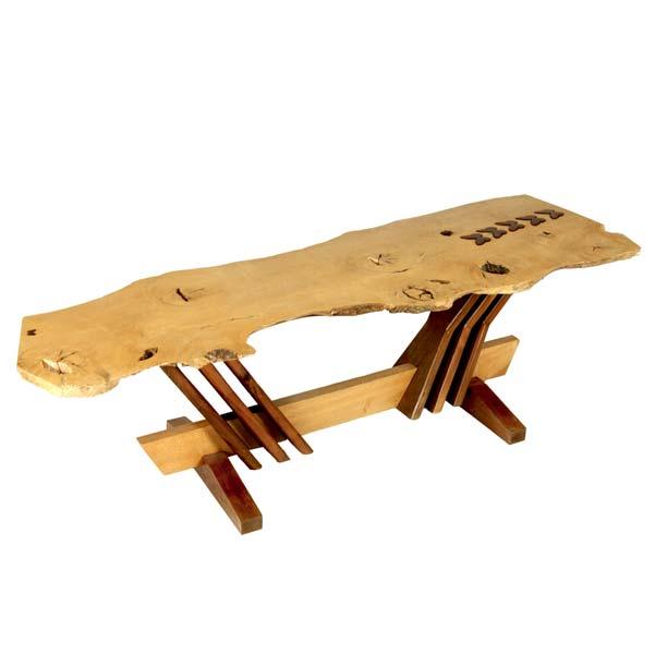 Appraisal: STUDIO Free edge coffee table with walnut butterflies tripled supports