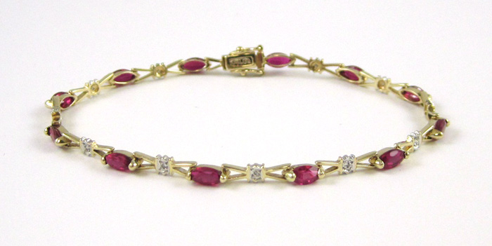 Appraisal: RUBY DIAMOND AND TEN KARAT GOLD BRACELET measuring inches in