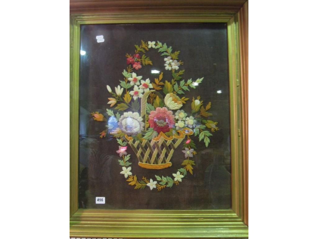 Appraisal: A needlepoint of a basket of flowers within a cushioned