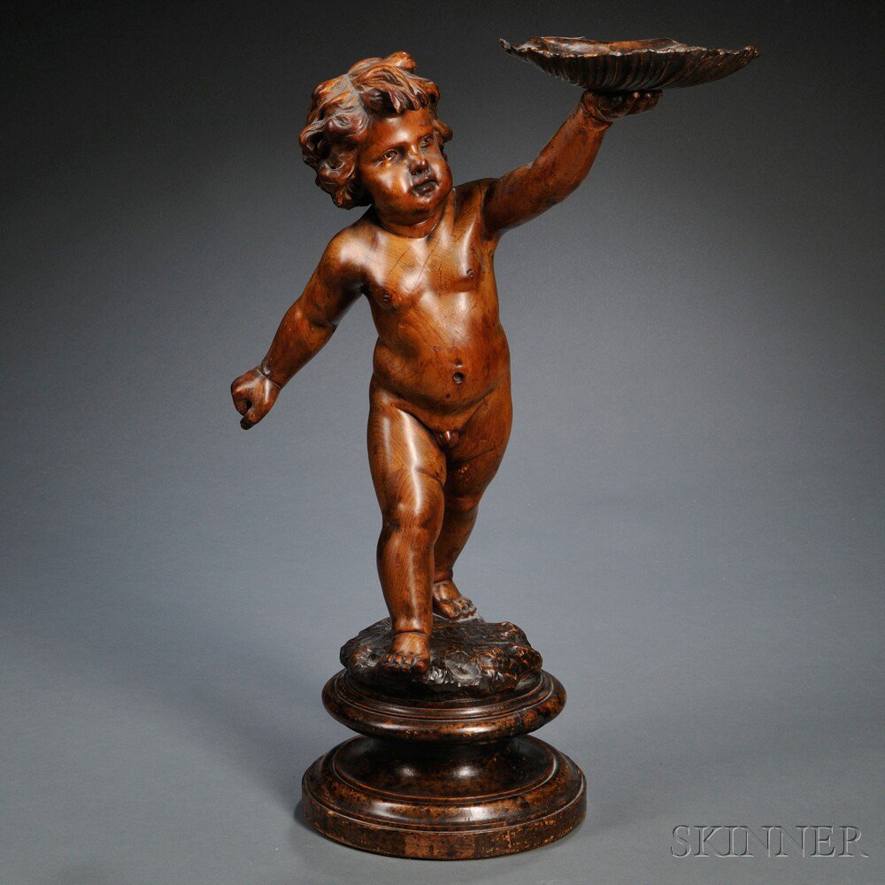 Appraisal: Carved Fruitwood Figure of a Putto Continental early th century