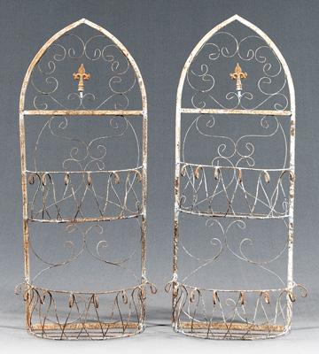 Appraisal: Pair iron hanging plant stands each arched with two tiers