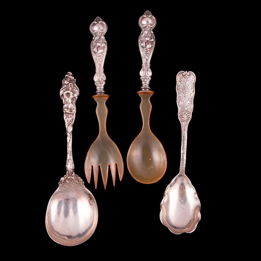 Appraisal: Four sterling serving spoons Four sterling serving spoons approx grams