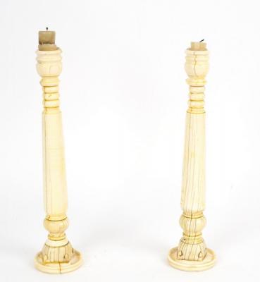 Appraisal: A pair of Anglo-Indian ivory candlesticks made from parts of