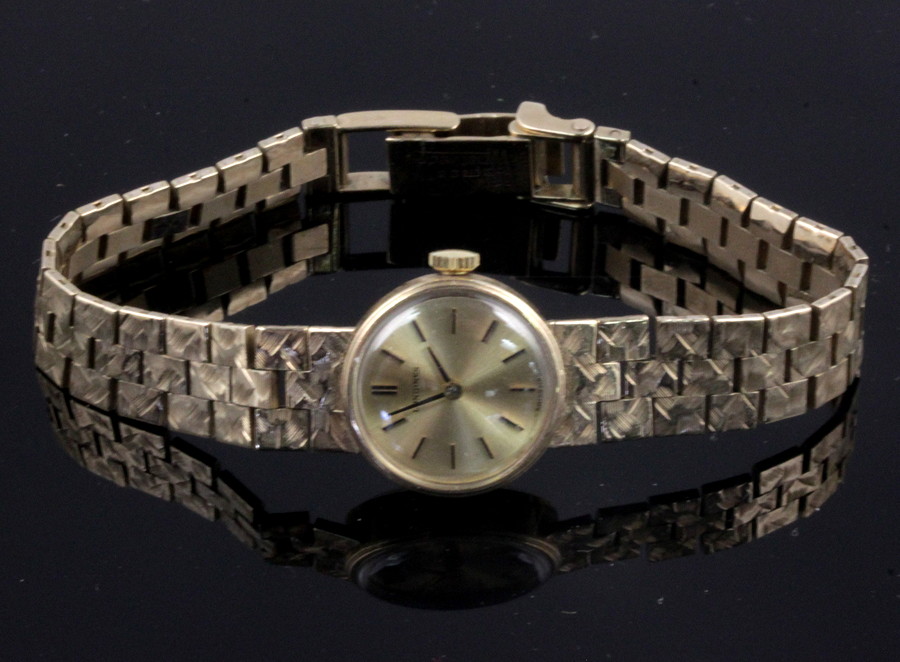 Appraisal: A lady's Longines wristwatch the circular dial on a textured