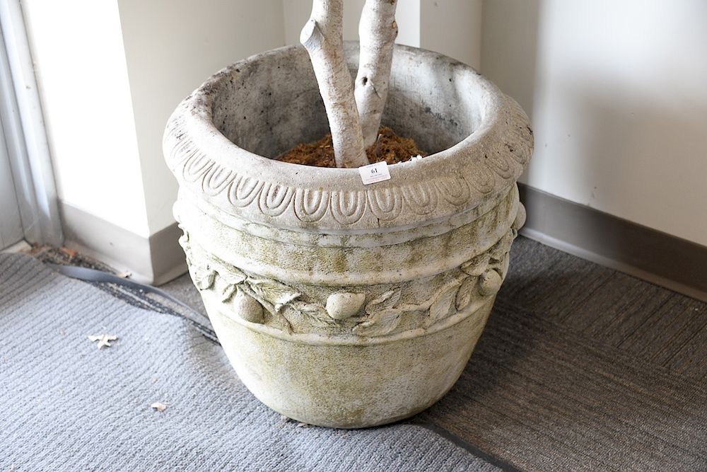 Appraisal: Pair of large Nina Studio cement planters with fruit vine