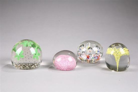 Appraisal: FOUR GLASS PAPERWEIGHTS Nine bulbous forms above a multi-colored cushion