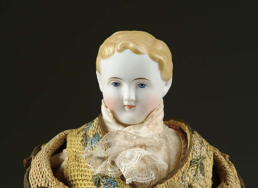 Appraisal: BLONDE HAIRED PARIAN MAN DOLL Extremely pale Parian with short