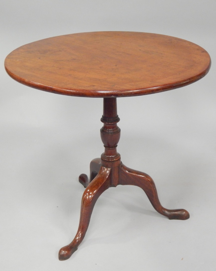 Appraisal: A George III mahogany supper table with circular tilt top