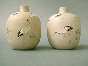 Appraisal: Pair of small Japanese ovoid vases with raised decoration of