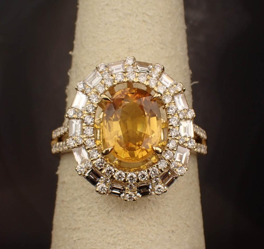 Appraisal: YELLOW SAPPHIRE DIAMOND AND FOURTEEN KARAT GOLD RING The yellow