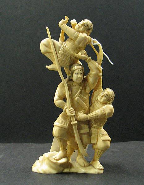 Appraisal: An ivory okimono of three warriors Carved with a central