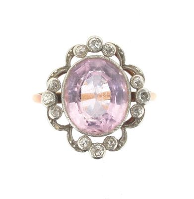 Appraisal: An Edwardian pink topaz and diamond cluster ring The oval