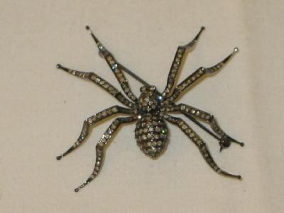 Appraisal: AN CT DARKENED GOLD SPIDER BROOCH set with approximately two