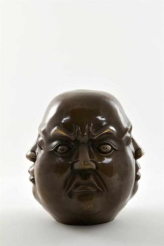 Appraisal: Chinese bronze sculpture of the four faces of life rich