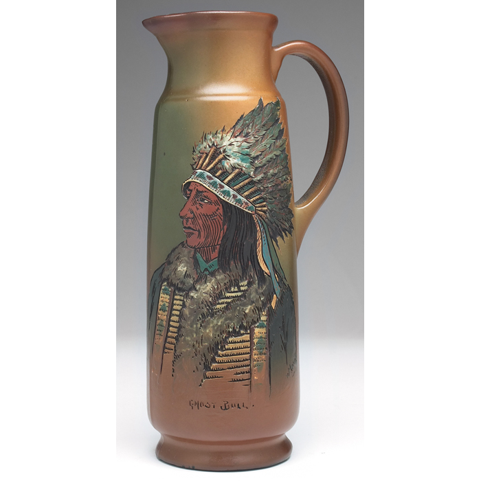 Appraisal: Weller Dickensware ewer unusualshape with an incised and painted NativeAmerican