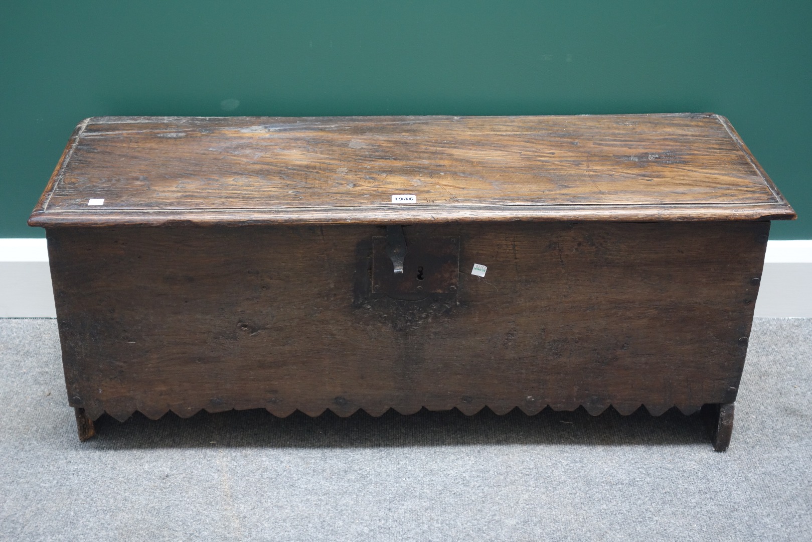 Appraisal: A th century oak five plank coffer with chevron dog