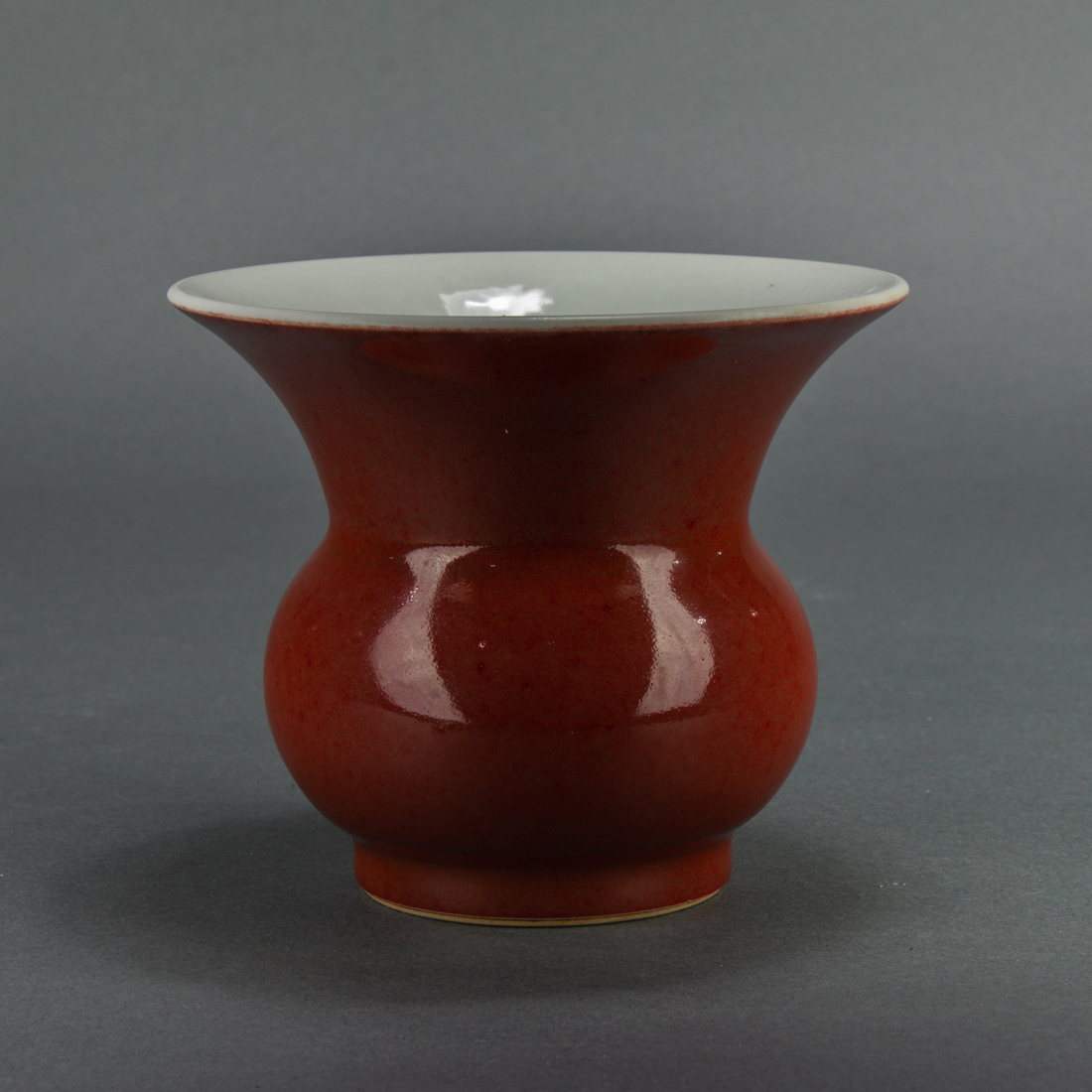 Appraisal: CHINESE COPPER-RED GLAZED ZHADOU Chinese copper-red glazed zhadou the compressed