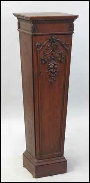 Appraisal: CARVED MAHOGANY PEDESTAL With a lower storage cabinet Condition No