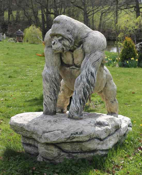 Appraisal: A composition garden statue modelled as gorilla on sloped plinth