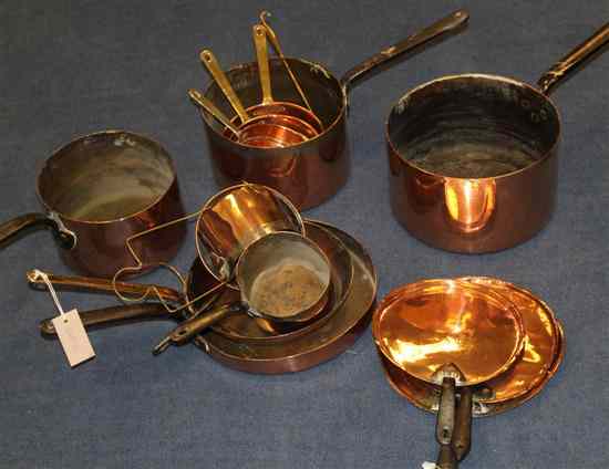 Appraisal: A th century part batterie de cuisine comprising graduated saucepans