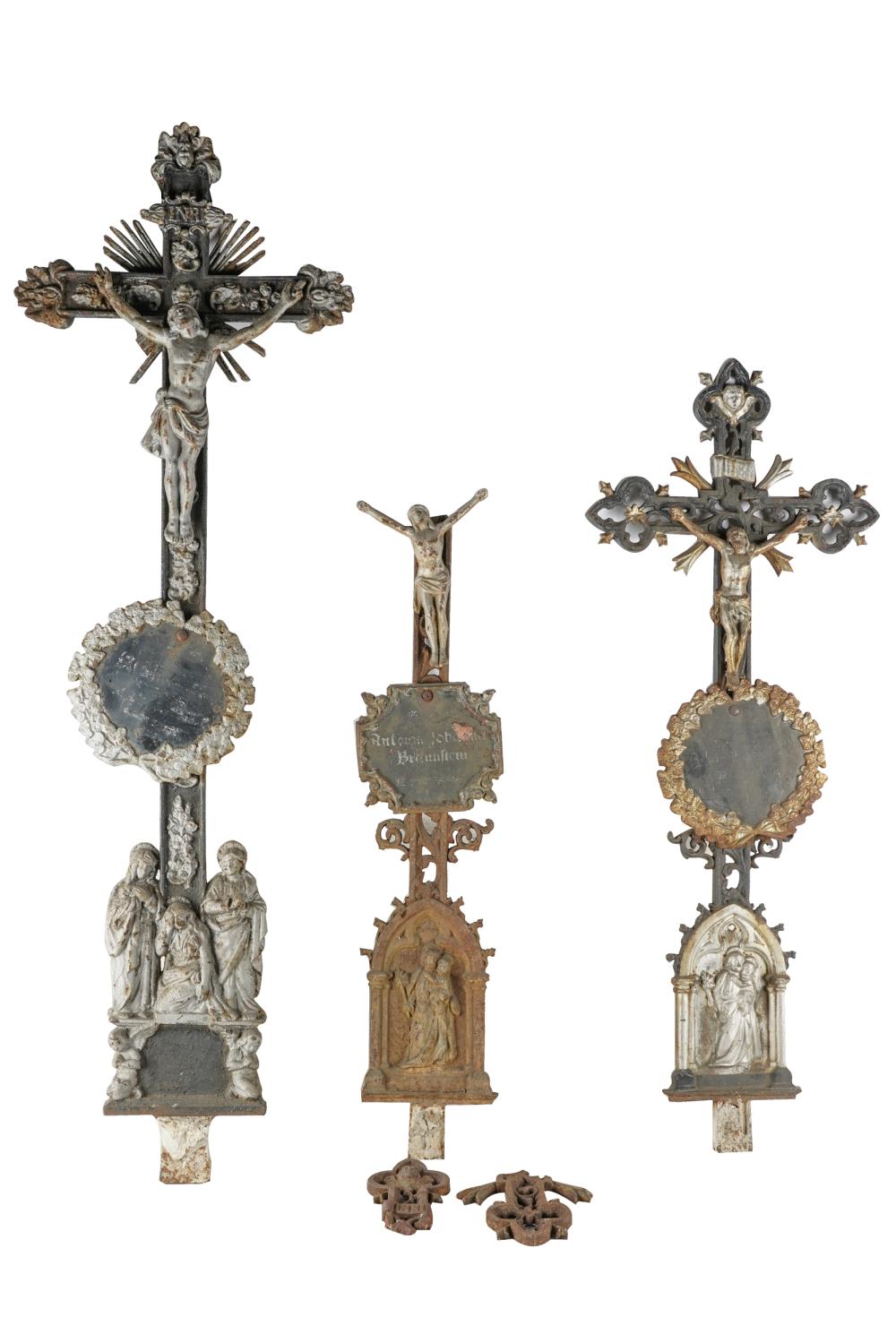 Appraisal: THREE CAST-METAL CEMETERY CRUCIFIXESCondition each with losses to paint oxidation