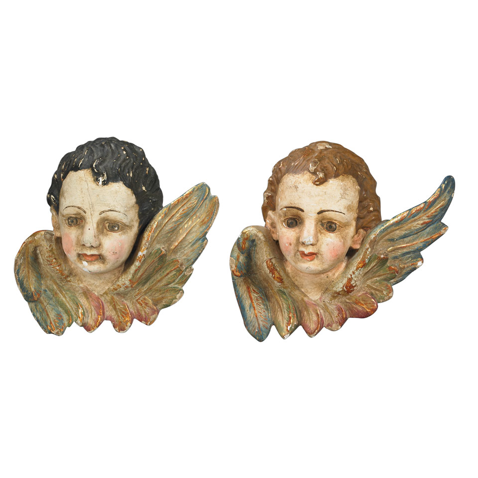 Appraisal: Two Italian Carved Polychromed and Parcel Gilt Cherubic Heads early