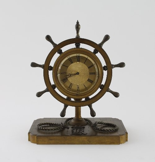 Appraisal: A ship's wheel mantel timepiece in an ormolu case monogrammed