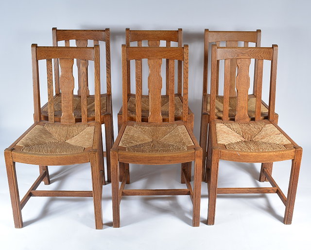 Appraisal: A set of six Heals oak dining chairscirca having rail