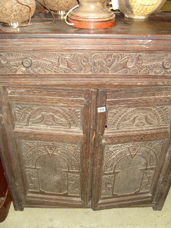 Appraisal: A Georgian oak side cupboard fitted with a single frieze