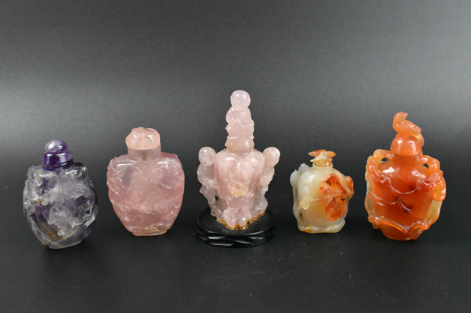 Appraisal: A group of Chinese snuff bottles carved rose quartz agate