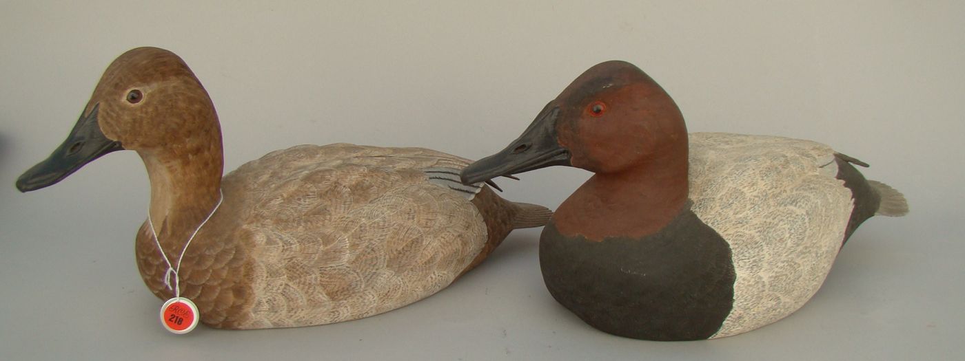 Appraisal: PAIR OF LIFE-SIZE CANVASBACK DECOYS Decoratively carved by Lewis A