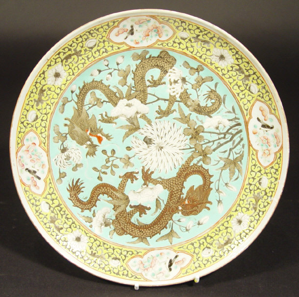 Appraisal: Oriental porcelain plate enamelled with scaled dragons chasing flowers in