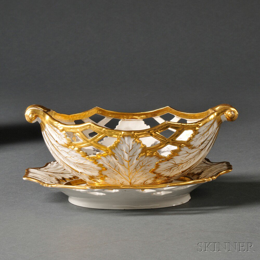 Appraisal: English Porcelain Basket and Stand early th century gilded and