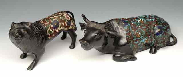 Appraisal: A CHINESE BRONZE AND CLOISONNE RECUMBENT OX and a Chinese