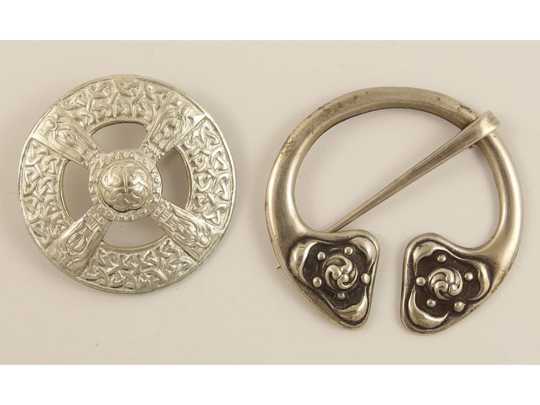 Appraisal: Two Alexander Ritchie broochesthe penannular shaped brooch has Celtic pattern