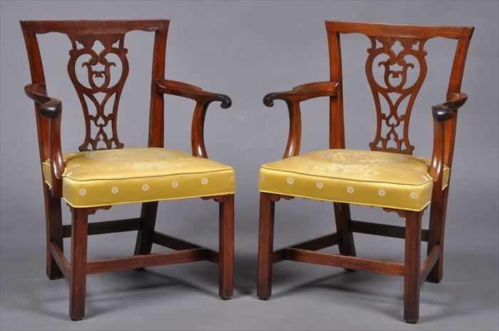 Appraisal: PAIR OF CHIPPENDALE CARVED MAHOGANY ARMCHAIRS Each slightly arched top