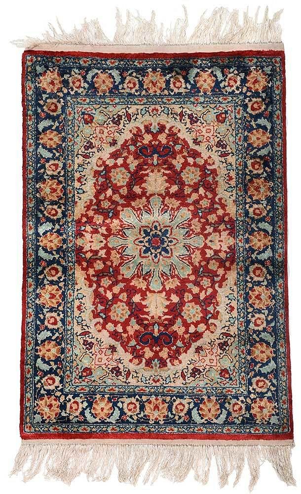 Appraisal: Handknotted Rug central medallion of green red field with ivory