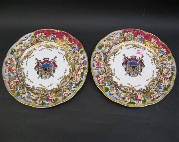 Appraisal: PAIR CAPODIMONTE PORCELAIN PLATES hand painted with coat of arms