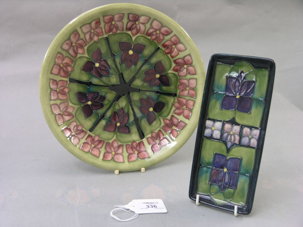 Appraisal: Two modern Moorcroft dishes one circular with crimson flowers against