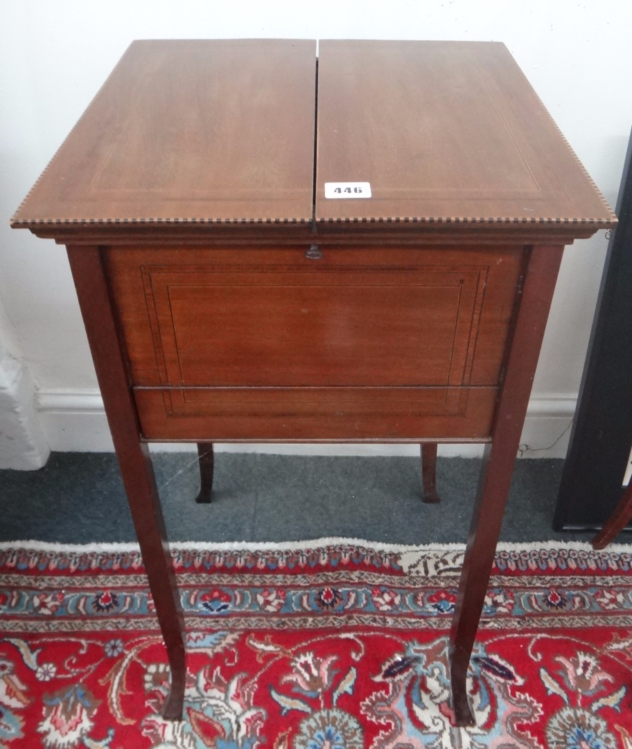 Appraisal: An Edwardian mahogany needlework table tulipwood crossbanded boxwood and ebony