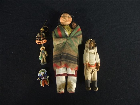 Appraisal: PAIR OF NORTH AMERICAN NATIVE AMERICAN DOLLS WITH THREE MINIATURE