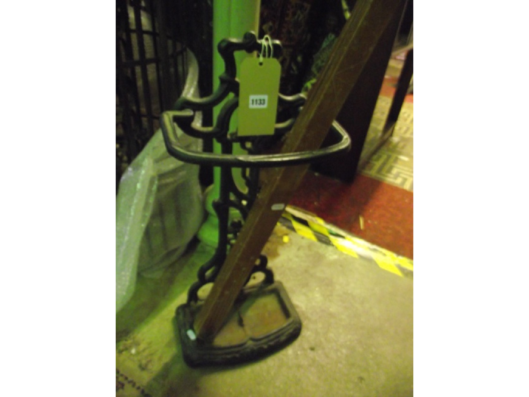 Appraisal: A cast iron umbrella stand with foliate detail and removable