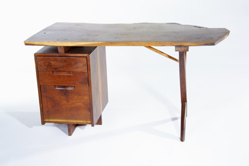 Appraisal: GEORGE NAKASHIMA Walnut Conoid desk its heavily-figured raised free-edge top