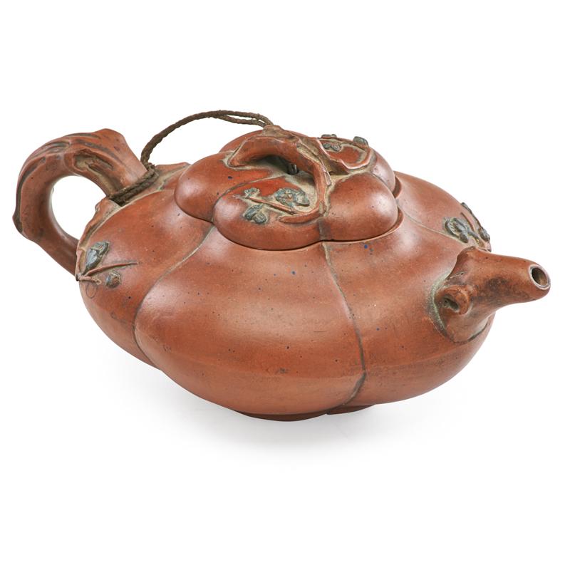 Appraisal: CHINESE TERRACOTTA TEAPOT Melon form with branch handle late Qing