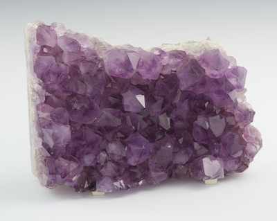 Appraisal: An Amethyst Geode Fragment The natural crystalline formation fragment of