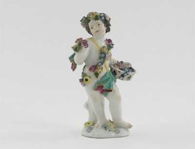 Appraisal: A Meissen figure of a putto draped in flower garlands