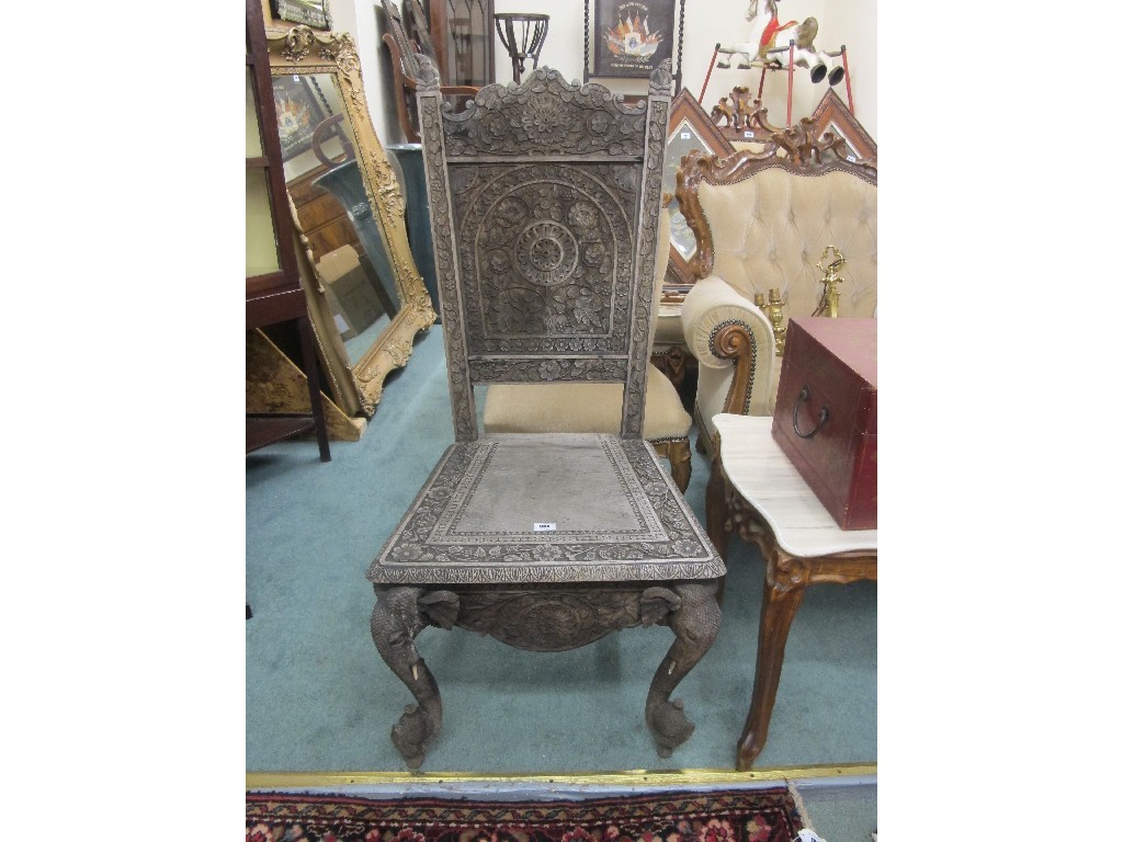 Appraisal: Burmese carved hall chair with elephant decoration