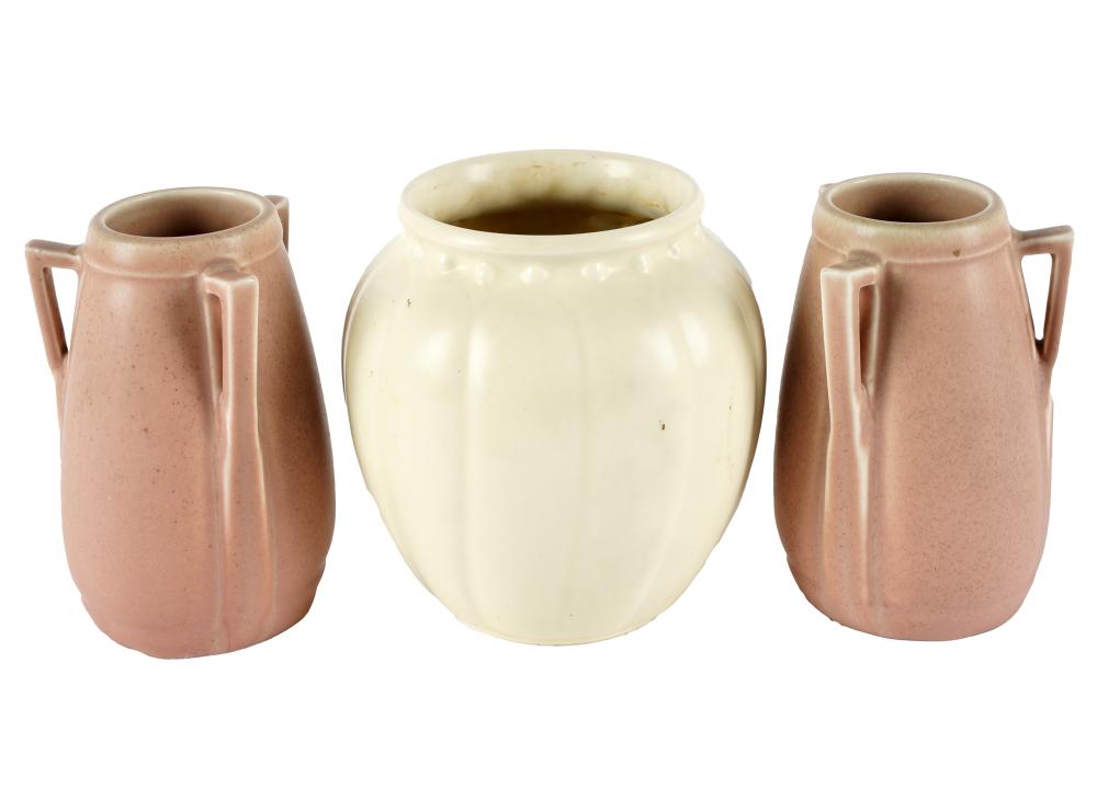 Appraisal: THREE ROOKWOOD POTTERY VASESmarked to undersides the cream-glazed vase and