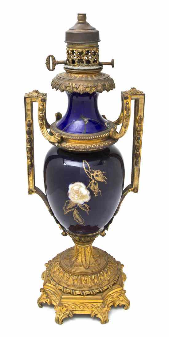 Appraisal: A Continental Gilt Bronze Mounted Porcelain Urn of baluster handled